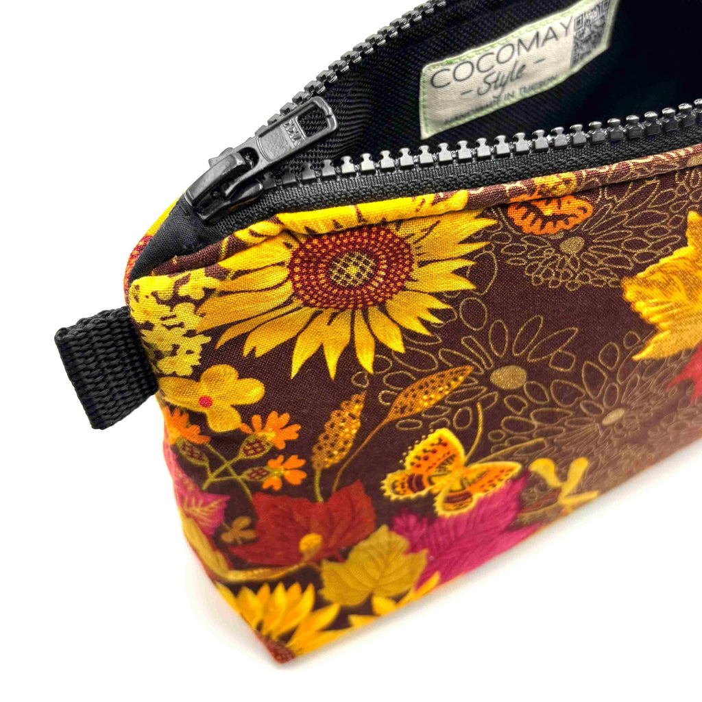 Zipper pouch with yellow florals on a brown background
