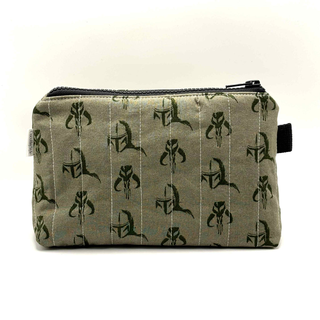 Zipper pouch with a green Mandalorian mudhorn pattern on a tan background