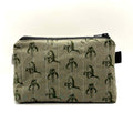 Zipper pouch with a green Mandalorian mudhorn pattern on a tan background