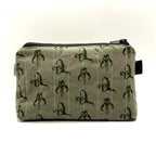 Zipper pouch with a green Mandalorian mudhorn pattern on a tan background