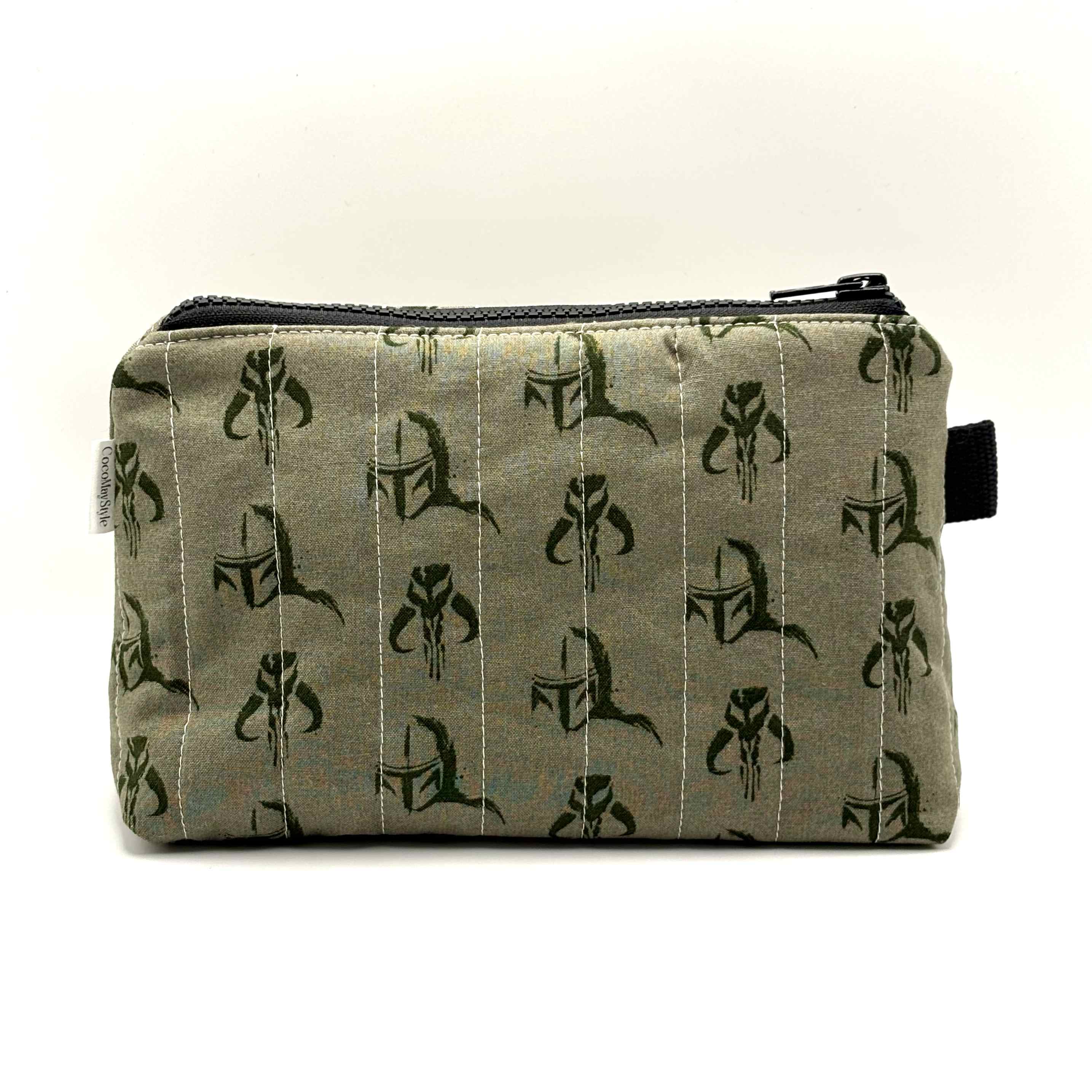Zipper pouch with a green Mandalorian mudhorn pattern on a tan background
