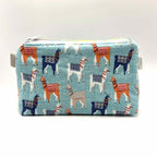 Zipper pouch with a llama pattern on a light blue background