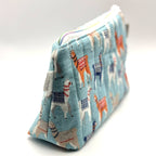 Zipper pouch with a llama pattern on a light blue background