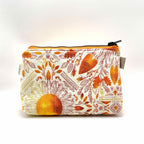 Zipper pouch with a pink, orange, and yellow floral pattern